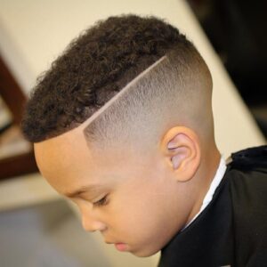 natural curls with skin fade hard part