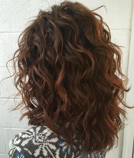 shag haircut with loose spiral perm