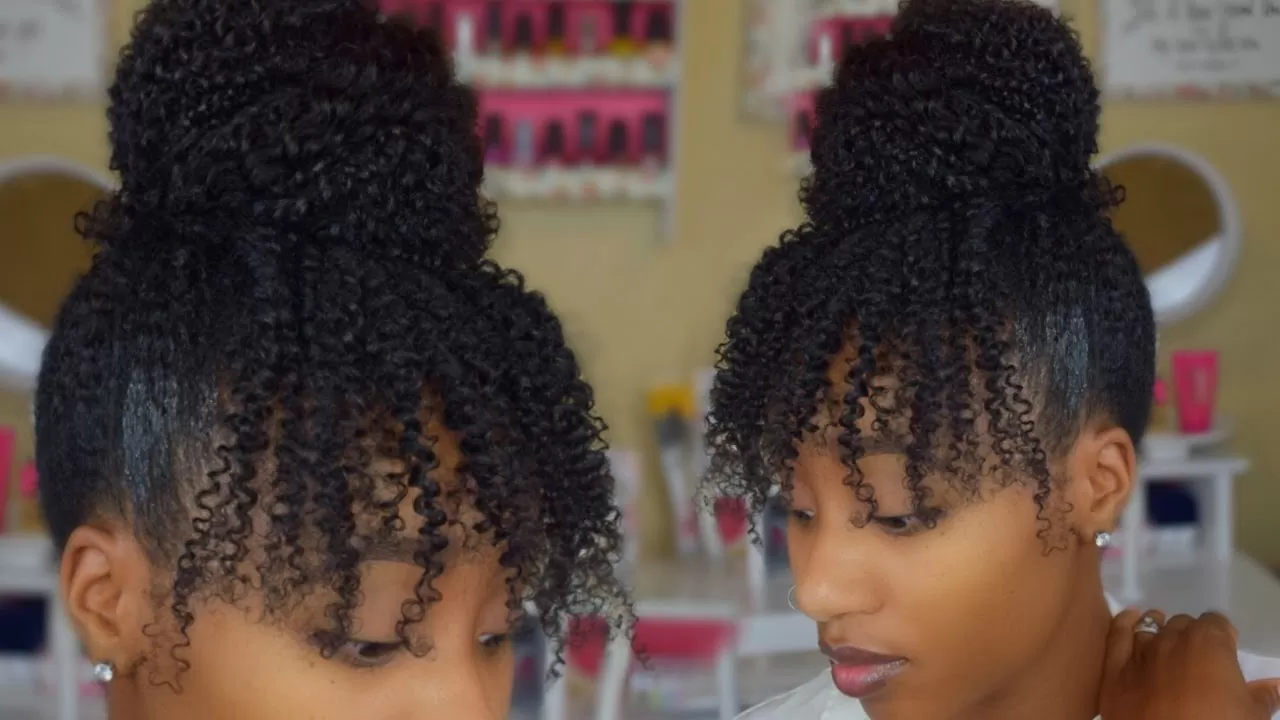 High bun and curly bangs