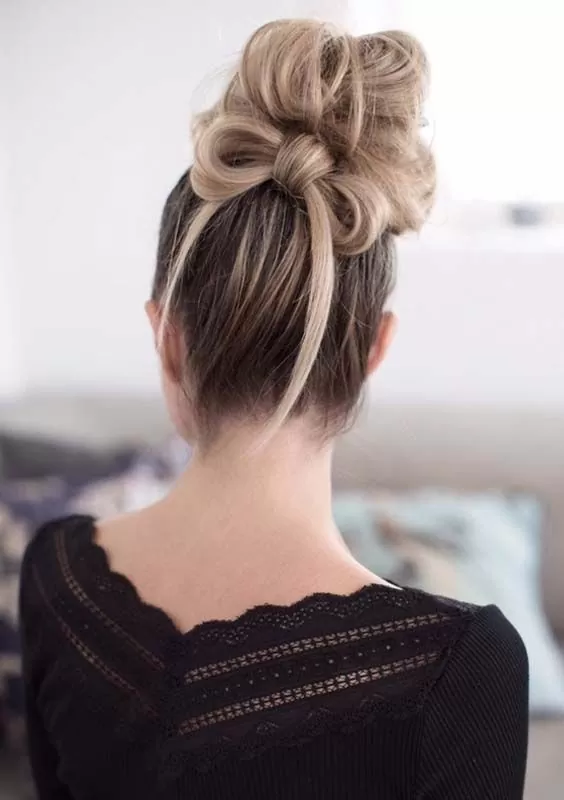messy bun with hair bow