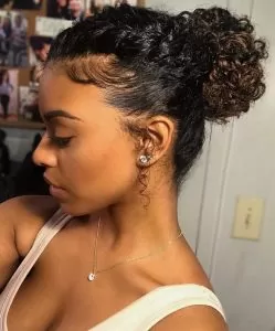 sleek styled bun curls